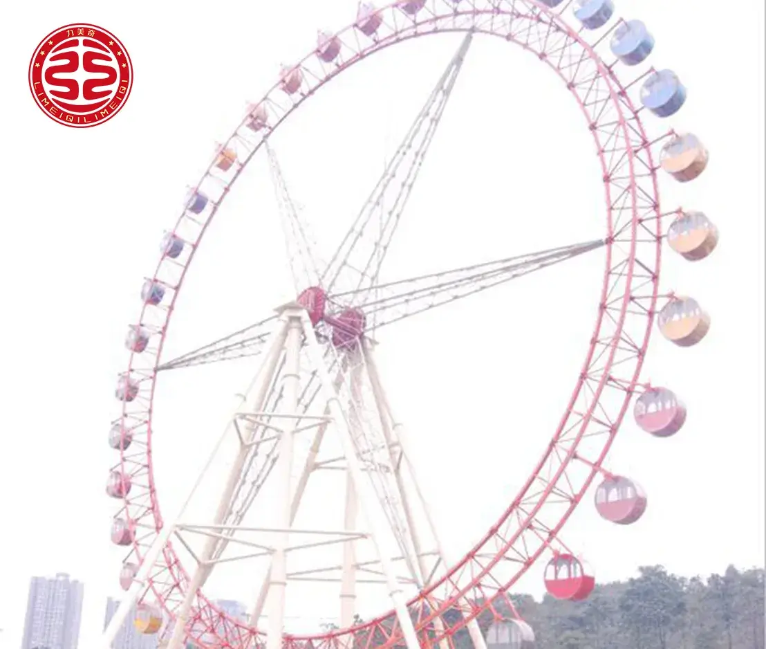 large observation wheel park attraction Wide shot of a large 49m observation wheel amusement ride installed in a city park